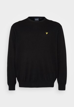 Pulover negru tricotat cu mâneci lungi și decolteu rotund. Prezintă un mic logo galben cu un vultur pe partea stângă a pieptului. Mansete și tiv elastic.