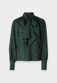 Blusa verde in tessuto morbido con motivo floreale, colletto annodato e maniche arricciate con polsini aderenti.