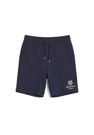 Pantalones cortos casuales de color azul marino con cintura de cordón, bolsillos laterales y un pequeño logo de tigre blanco con texto en la parte inferior izquierda de la pierna.