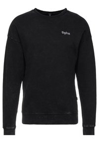 Felpa nera in tessuto strutturato, con scollo tondo a costine, spalle scese e un piccolo logo ricamato sul petto.