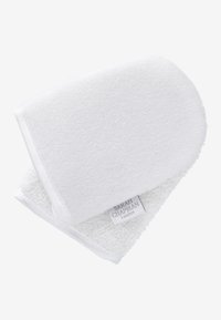 Vit bomull exfolierande handske med en mjuk frottétextur. Har en slät kant och en liten etikett med texten "SARAH CHAPMAN London."