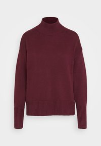 Pull en tricot bordeaux avec un col haut, des poignets et un ourlet à côtes, offrant une coupe ample et une texture lisse sur l'ensemble du corps.