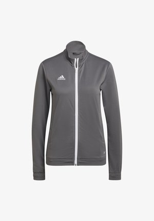 Pilkas sportinis zip-up džemperis, pagamintas iš lygaus audinio. Turi aukštą apykaklę, baltą užtrauktuką ir "adidas" logotipą kairėje krūtinės pusėje.