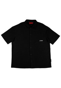 Black short-sleeve button-up shirt with a collar, featuring a left chest pocket and white embroidered logo. Smooth textured fabric.