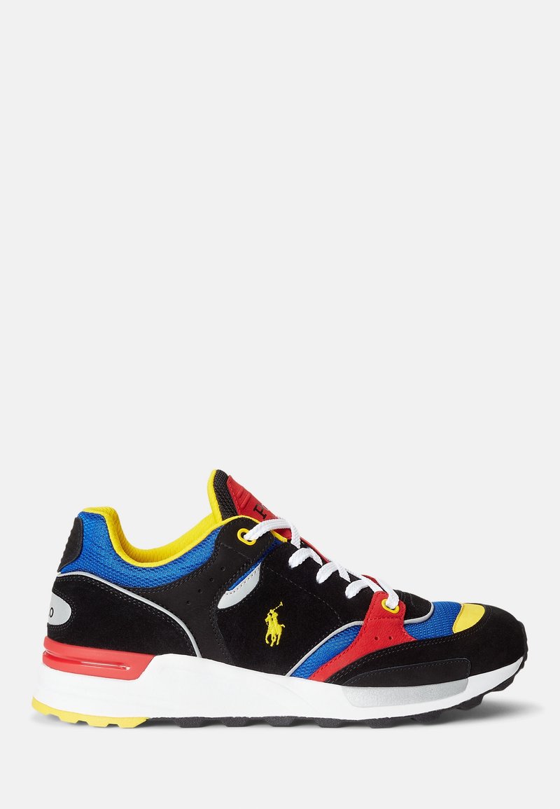 Black suede sneakers with red, yellow, and blue accents. Features a white sole, lace-up design, and logo detail on the side.