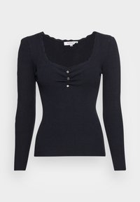 Haut marine à manches longues côtelé avec un décolleté festonné, orné de trois boutons décoratifs au centre devant. Coupe ajustée, tissu texturé.