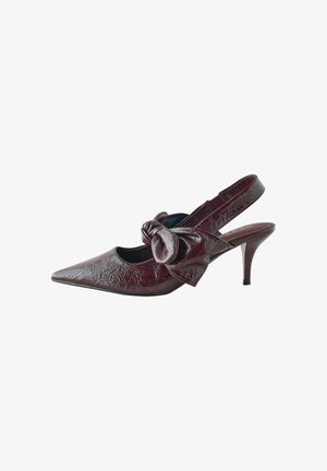 Burgundy patent leather slingback pump with a pointed toe and a bow accent on the side. Features a thin heel and textured finish.