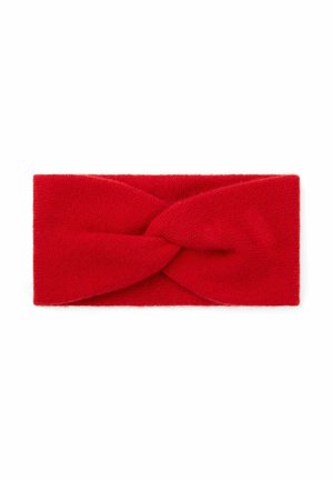 Bandeau en tissu tricoté rouge avec un design de nœud torsadé au centre sur fond blanc.
