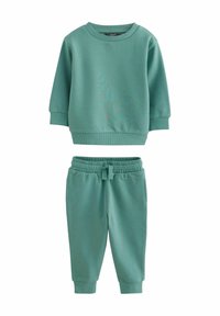 Grøn sweatshirt og matchende joggere lavet af blødt bomuldsstof. Sættet har en ribbet halsudskæring og manchetter samt en elastisk talje på bukserne.