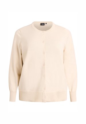 Knopjesvest in off-white, gebreide stof. Heeft een ronde hals, geribde manchetten en vijf bijpassende knopen aan de voorkant.