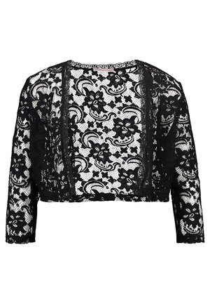 Gilet court noir en dentelle, à manches longues, ouvert sur le devant et orné d’un motif floral sur toute sa surface, sur fond blanc.