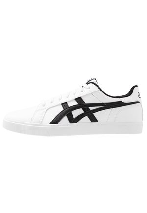 Sneaker bianca a taglio basso con strisce nere, chiusura con lacci e suola piatta in gomma.