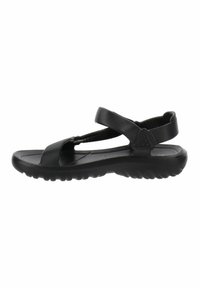 Sandal nera con suola piatta, dotata di fascette testurizzate e cinturino alla caviglia regolabile. Leggera e progettata per il comfort.