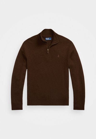 Pullover castanho com gola alta, meio fecho éclair e punhos canelados. Feito de um tecido de malha macia, apresenta um pequeno logotipo no peito.