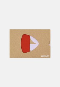 Brown cardboard packaging featuring a cutout shape revealing red and purple elements. Printed text in the bottom right reads "zalando."