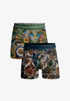 Dve boxerky s komplikovanými umeleckými potlačami; jedna s motívmi slnečníc a klasickými ornamentmi, druhá s korunovanou postavou, rytierom a lekárom počas moru.