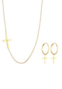 Goldfarbene Schmuckset mit einer kurzen Kettenhalskette mit einem Kreuzanhänger und passenden Creolen, beide aus 925er Sterlingsilber hergestellt.