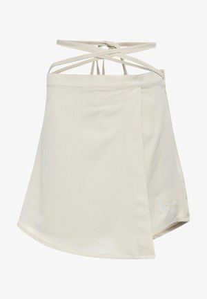 Bež kleidi, mis on valmistatud kergest kangast, millel on seljaosas ristuvad rihmad ja eesdiskreetne broderiga logo.