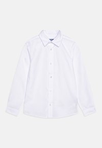 Chemise blanche à manches longues avec col pointu, boutons visibles sur le devant et manches avec poignets, étalée à plat sur un fond clair.