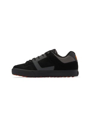 Black suede and gray synthetic shoes with a low profile, featuring black laces, rounded toe, and an orange outsole. Reinforced heel detail.