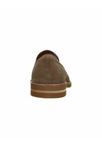 Brown suede shoe with a rounded toe, flat heel, and a contrasting light-colored stripe on the sole. Textured surface visible.