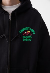 Black zip-up hoodie in cotton, featuring a colorful graphic logo on the chest. Includes drawstring hood and metal zipper detail.