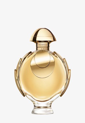 Runde goldfarbene Parfümflasche mit kuppelförmigem Verschluss und dekorativen runden Akzenten, beschriftet mit "rabanne" am Flaschenhals.
