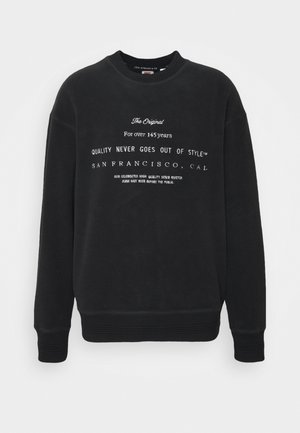 Schwarzes Sweatshirt mit Rundhalsausschnitt und weißem Text „The Original Seit über 145 Jahren geht Qualität nie aus der Mode San Francisco, Cal.“