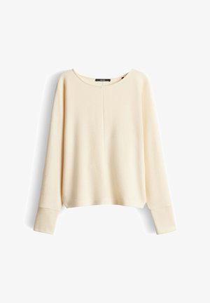 Roomkleurige ribgebreide trui met lange mouwen, wijde manchetten en een ronde hals, afgebeeld tegen een witte achtergrond.