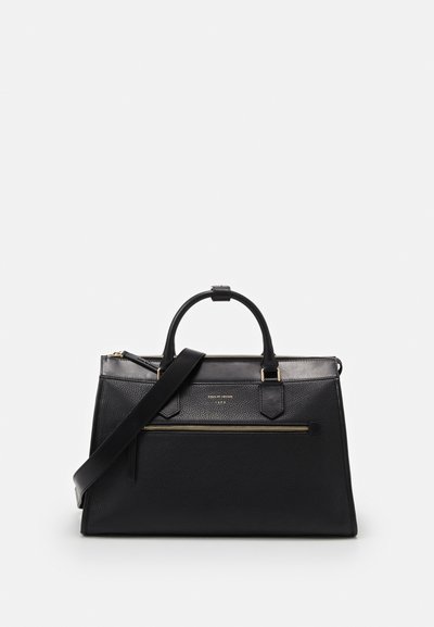 Black leather handbag with textured finish, dual handles, and adjustable shoulder strap. Features a gold zip pocket on the front.