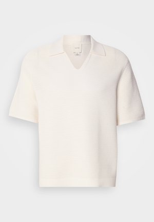 Short-sleeve, V-neck polo in textured white fabric. Features a collar and a subtle ribbed pattern, offering a structured look.