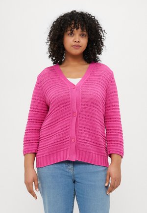 Bright pink knit cardigan with a V-neck, buttons down the front, and a textured wave pattern. Features three-quarter sleeves and ribbed hem.
