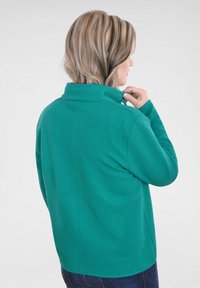 Navigazione Lichte jas - petrol