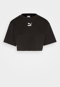 Černé zkrácené tričko vyrobené z bavlny, s kulatým výstřihem a krátkými rukávy. Bílé logo Puma potištěné na přední straně.
