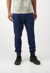 adidas Sportswear FEELCOZY PANT - Παντελόνι φόρμας - dark blue/white