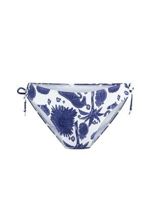 Slip bikini a stampa floreale navy realizzato in tessuto elasticizzato. Presenta laccetti regolabili ai lati e un design a vita bassa. Sfondo bianco con motivi dettagliati.