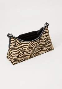 Zippered handbag with a triangular shape, made of textured fabric featuring a beige and black tiger stripe pattern. Black leather accents.