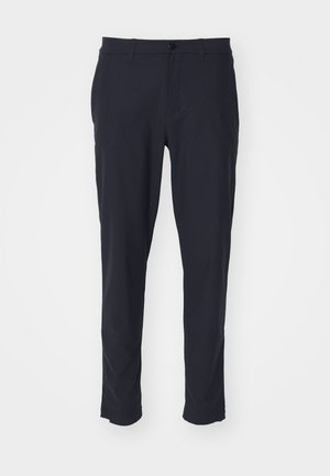 Navy blue tailored trousers made from smooth fabric; features a button closure, belt loops, and side pockets; slim fit design.