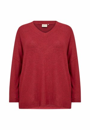 Piros, hosszú ujjú, V-nyakú felső, puha, texturált anyagból készült, laza szabással. Zsúfolt vállakkal és oldalsó hasítékokkal rendelkezik a kényelem érdekében.