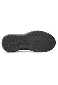 Black rubber shoe sole with textured grip patterns, featuring deep grooves and unique diamond shapes for traction and durability.