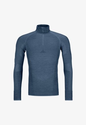 Long-sleeve athletic shirt in dark blue fabric. Features a high collar, half-zipper, and textured accents on sleeves. Stretchy fit.