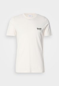 Tricou din bumbac în off-white, cu guler rotund, mâneci scurte și un grafic mic în alb și verde pe partea stângă a pieptului.