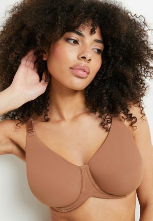 Senza cuciture, reggiseno marrone con spalline regolabili e una texture liscia. Il tessuto è leggero e presenta un design con coppe sagomate senza cuciture visibili.