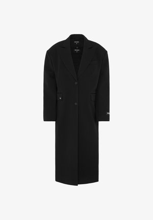 Zwarte oversized jas met een geknipte kraag, enkele knoopsluiting, voorzakken en een gladde textuur. Bevat een merketiket op de mouw.
