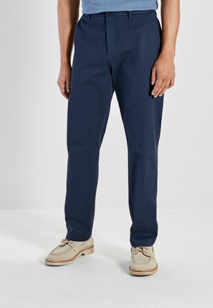 Pantaloni blu navy con un design a gamba dritta, realizzati in tessuto leggero, con vita piatta e tasche laterali.