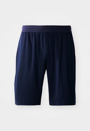 Pantalones cortos hasta la rodilla de color azul marino con una cinturilla elástica de patrón a cuadros morado, mostrados sobre un fondo blanco.