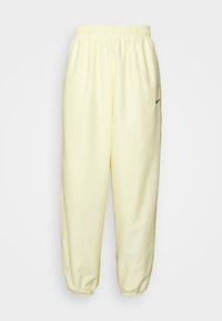 Nike Sportswear Träningsbyxor - light yellow