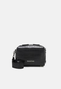 Black textured leather crossbody bag with a crocodile pattern, silver hardware, top zip closure, and a logo-embossed adjustable strap.