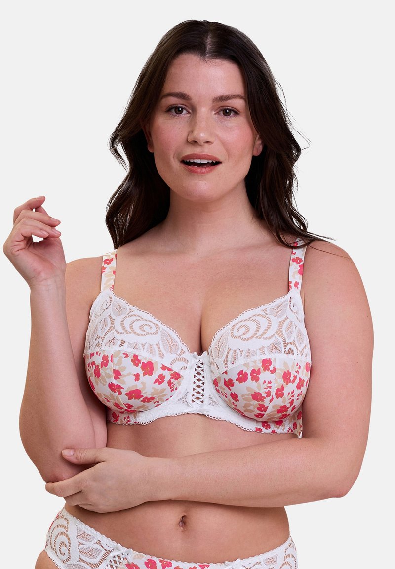 Reggiseno in pizzo floreale con colori bianchi e pastello, caratterizzato da motivi floreali, spalline regolabili e una chiusura frontale decorativa.