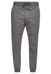 Grå joggerbyxor i lättviktsmaterial, med elastisk midjeband och snörning, avsmalnande ben och subtila sömnadsdetaljer.